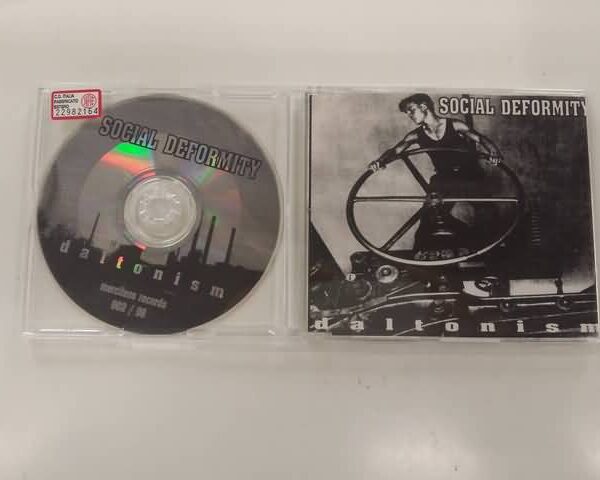CD - SOCIAL DEFORMITY - DALTONISM