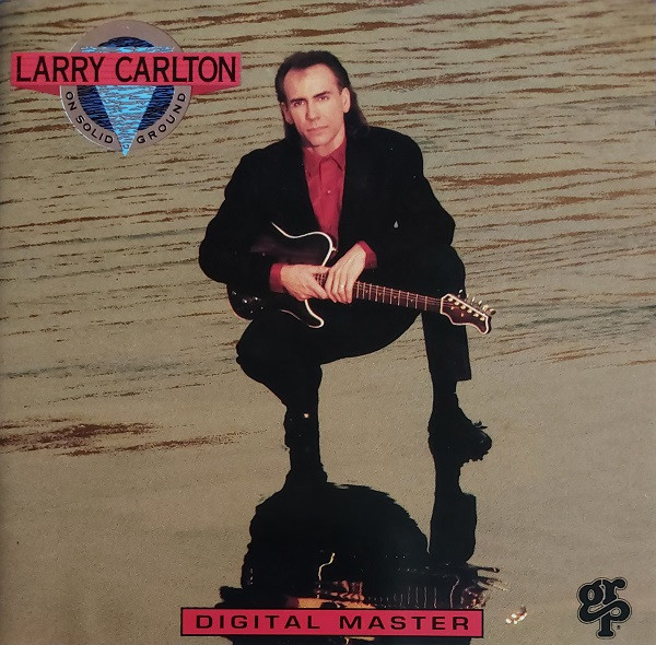CD - Larry Carlton - On Solid Ground